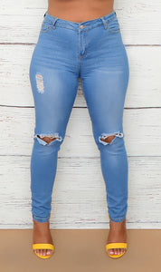 Women's Light Wash Distressed Mid Rise Jeans