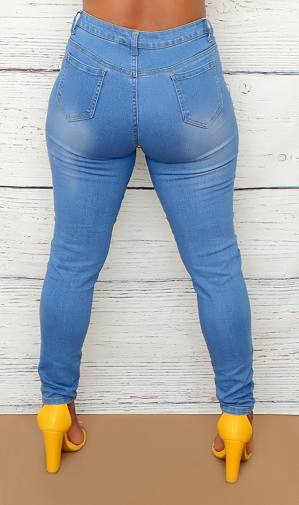 Women's Light Wash Distressed Mid Rise Jeans